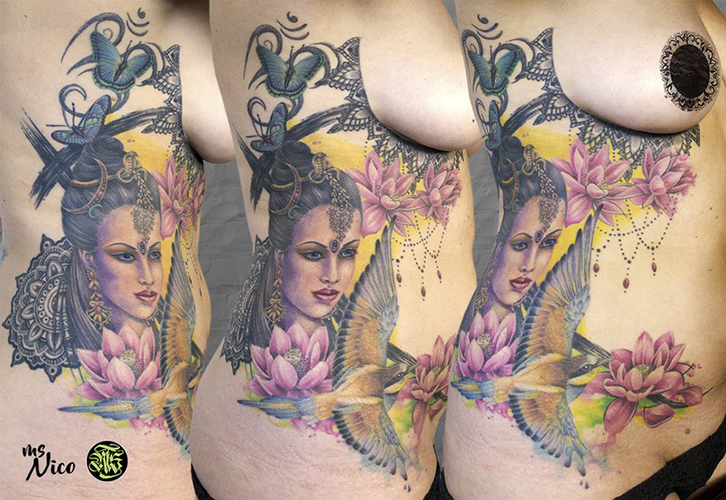 Incredibly colorful and detailed mixed-style-tattoo, by Shop-Mama Miss Nico, incorporating numerous traditional elements of India. missnico allstyletattooberlin allstyletattoo asiantattoo indiantattoo colortattoo mandalatattoo realistictattoo lotustattoo birdtattoo underboobtattoo ribtattoo sidetattoo unterbrusttattoo seitentattoo rippentattoo lace spitze butterflies schmetterlinge